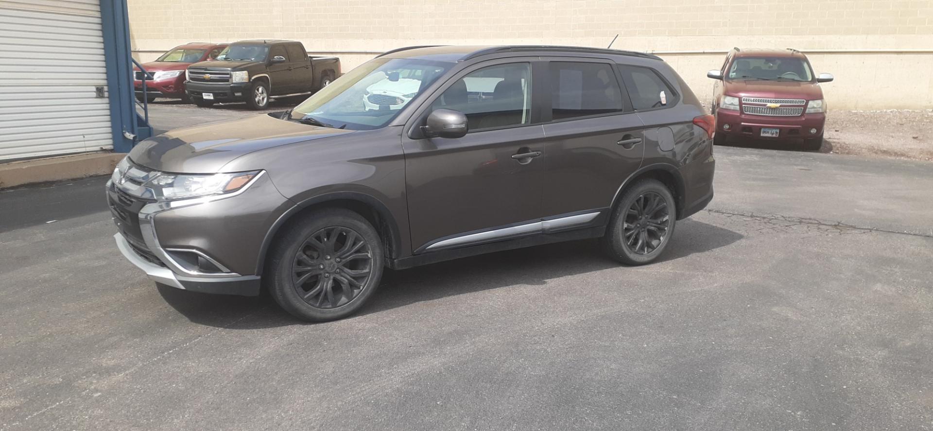 2016 Mitsubishi Outlander SE AWD (JA4AZ3A37GZ) with an 2.4L L4 DOHC 16V engine, CVT transmission, located at 2015 Cambell Street, Rapid City, SD, 57701, (605) 342-8326, 44.066433, -103.191772 - CARFAX AVAILABLE - Photo#1